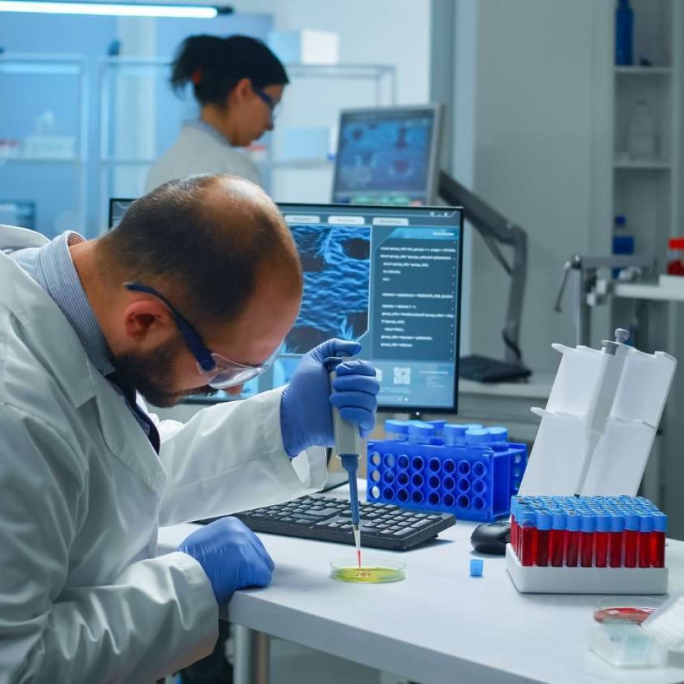 scientist-putting-blood-sample-from-test-tube-with-micropipette-petri-dish-analysing-chemical-reaction.jpg